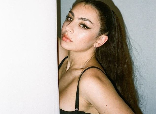 Charli XCX reveals she's taken up painting to ease her 'frustration' at being stuck behind closed doors as COVID-19 lockdown keeps her at home