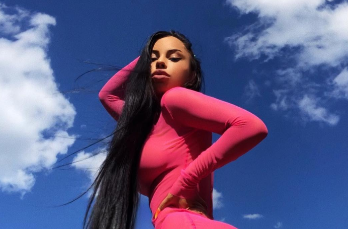 What is this Fashion Nova?! People Are Baffled By Model's Strange Pose As She Shows Off Tiger Print Dress