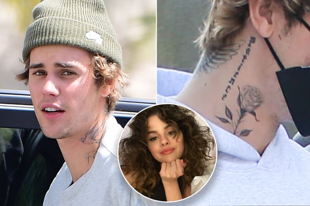 Justin Bieber got a new tattoo for his ex Selena Gomez? Fans are convinced the rose on his neck has the letter “S” in it!